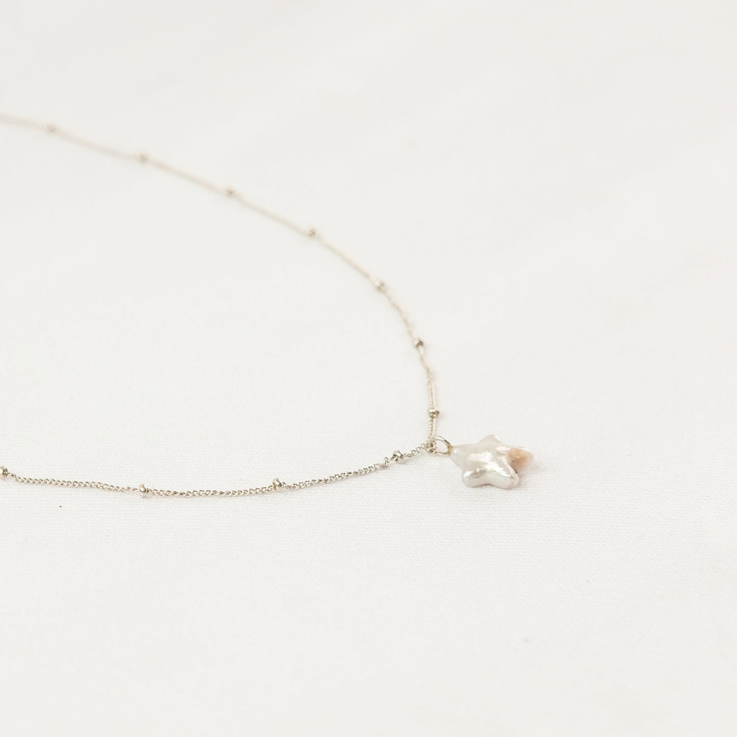 Suri Necklace - Star Pearl Necklace